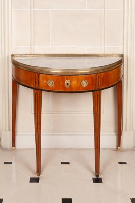 a small table with a mirror on top of it