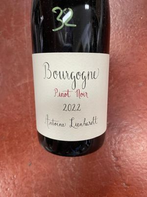 a bottle of wine that is sitting on a table