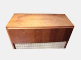 a wooden box that has a white tile on it