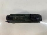 an overhead view of a black train engine on a white surface