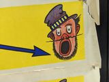three stickers with cartoon characters on them on the wall