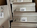 boxes of electronic devices are stacked on top of each other in a cardboard box