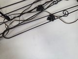 a lot of wires that are hanging on the wall