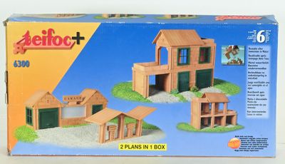 a box with a picture of a wooden building set