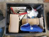 a box full of assorted items sitting on the floor