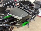 a close up of a motorcycle parked in a garage