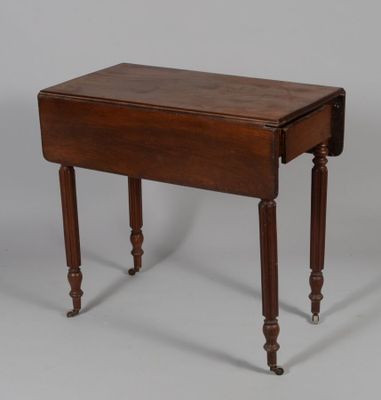 an image of a small wooden table with a drawer on it