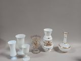 a lot of vases that are sitting on a table