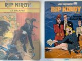 two books of comics are sitting on a white surface