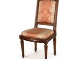 une image d'une chaise avec un siège rembourré à rayures