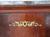 a close up of a wooden cabinet with a metal handle