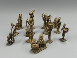 a group of bronze figurines of various sizes and shapes