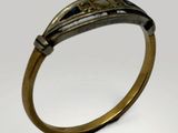 a close up of a gold ring with a diamond on it