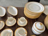 a lot of plates and cups on the table