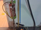 a vacuum and a broom on the floor next to a wall