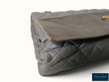 an image of a purse that is on a white surface