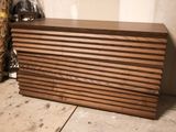 a picture of a large wooden chest of drawers