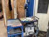 a small work station with a clock on the wall