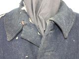 a close up of a jacket with holes on it