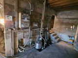 a room that has a lot of pipes and a tank