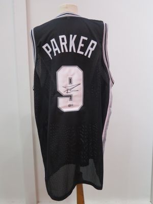 a close up of a basketball jersey on a mannequin stand