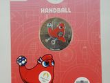 a close up of a coin on a stand on a table