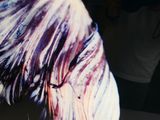 a close up of a woman ' s hair with purple streaks on it
