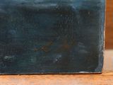 a blue box sitting on top of a wooden table