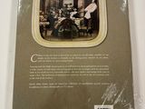 the back cover of a book with a picture of a group of people sitting at a table