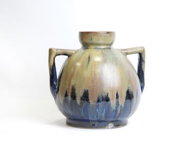 a blue and brown vase with handles on a white background