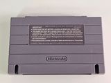 the gameboy is sitting on a white surface with a white background