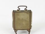 antique brass suitcase with beaded handle on stand