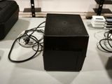 a black box sitting on top of a white table