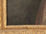 a picture of a painting of a woman in a gold frame