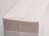 a white box that has a toothbrush inside of it