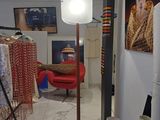 a lamp that is on a stand in a room