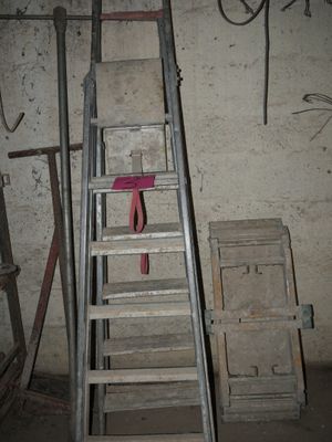 a ladder that is leaning against a wall in a room