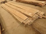 several pieces of wood are stacked on top of each other in a room