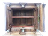 an old wooden cabinet with a door open on the inside