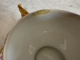 a close up of a bowl with a banana in it