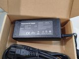 an open box with a charger and a cord in it