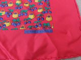 a red shirt with a picture of a fruit pattern on it