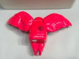 a pink toy with a skull on it sitting on a table