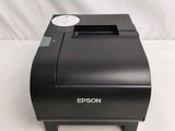 a close up of a printer on a table with a white background