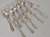 a lot of silver spoons and spoon spoons on a table