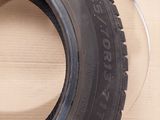 a tire that is sitting on top of a wooden table