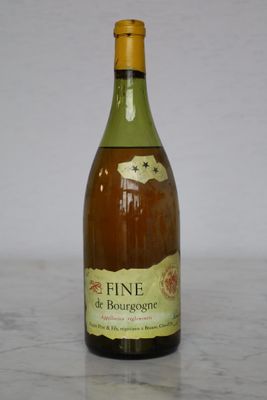a bottle of wine that is sitting on a table