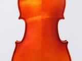 an orange violin sitting on top of a white surface