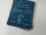 a small blue book on a white table