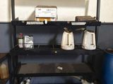 a shelf that has a lot of items on top of it